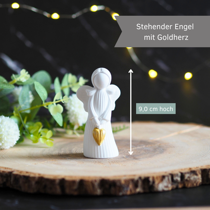 Engel, stehend aus weißer Gießkeramik - mit goldenem Herz in der Hand
